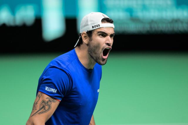 Italy's Matteo Berretini reacts after winning against Austria's Jurij Rodionov during their Davis Cup men's singles quarter finals tennis match, at the Super Tennis Arena, in Bologna, northen Italy, on November 19, 2025. (Photo by Tiziana FABI / AFP)
