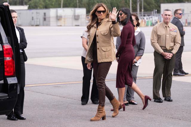 US First Lady Melania Trump and Second Lady Usha Vance (C-R) disembark from their aircraft upon arrival at Albert J. Ellis Airport in Jacksonville, North Carolina, November 19, 2025, as they travel to visit military families. First Lady Melania Trump and Second Lady Usha Vance visit military members and their families at Camp Lejeune in North Carolina. (Photo by SAUL LOEB / AFP)