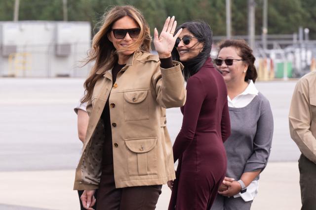 US First Lady Melania Trump and Second Lady Usha Vance (C) disembark from their aircraft upon arrival at Albert J. Ellis Airport in Jacksonville, North Carolina, November 19, 2025, as they travel to visit military families. First Lady Melania Trump and Second Lady Usha Vance visit military members and their families at Camp Lejeune in North Carolina. (Photo by SAUL LOEB / AFP)