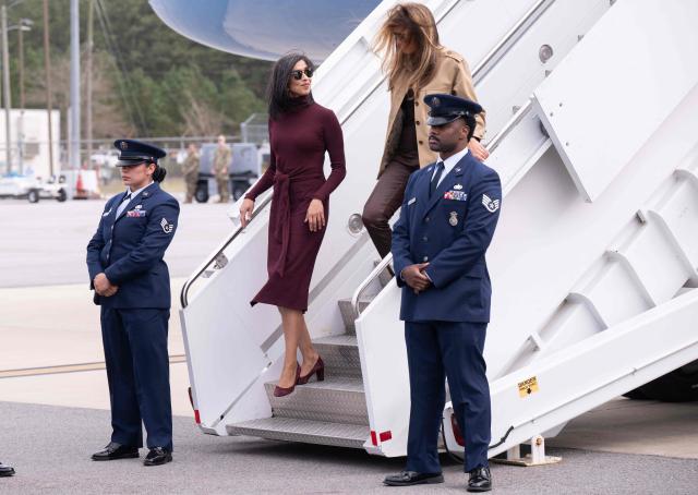 US First Lady Melania Trump and Second Lady Usha Vance (L) disembark from their aircraft upon arrival at Albert J. Ellis Airport in Jacksonville, North Carolina, November 19, 2025, as they travel to visit military families. (Photo by SAUL LOEB / AFP)
