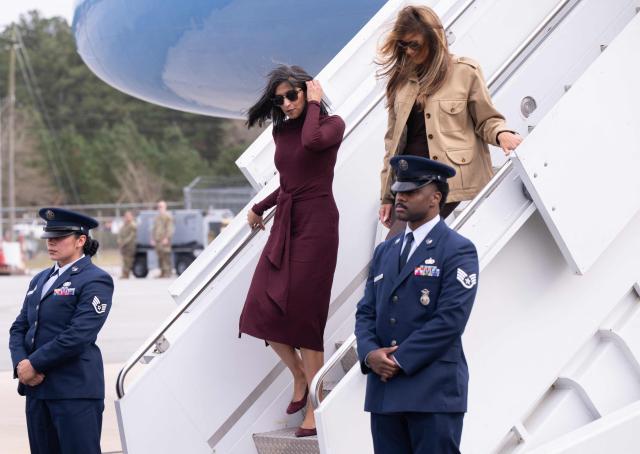US First Lady Melania Trump and Second Lady Usha Vance (L) disembark from their aircraft upon arrival at Albert J. Ellis Airport in Jacksonville, North Carolina, November 19, 2025, as they travel to visit military families. (Photo by SAUL LOEB / AFP)