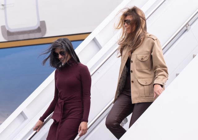US First Lady Melania Trump and Second Lady Usha Vance (L) disembark from their aircraft upon arrival at Albert J. Ellis Airport in Jacksonville, North Carolina, November 19, 2025, as they travel to visit military families. (Photo by SAUL LOEB / AFP)