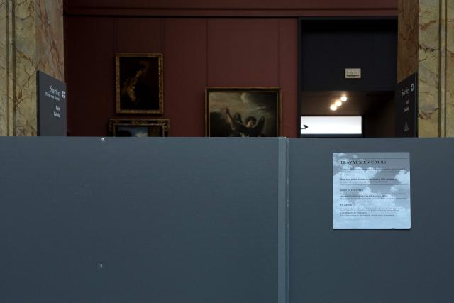 This photograph shows a closed access to a room of the Department of Paintings at the Denon wing of the Louvre Museum in Paris on November 19, 2025. (Photo by Sébastien DUPUY / AFP)