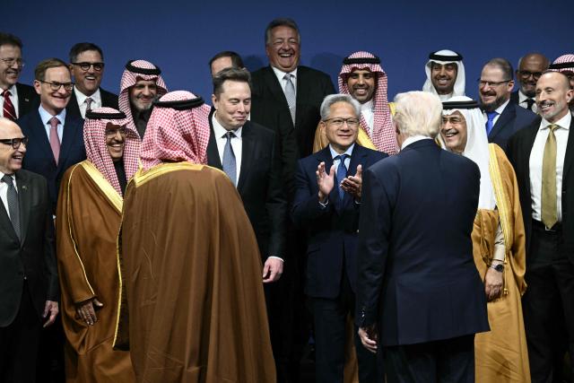US President Donald Trump, Saudi Crown Prince, Prime Minister Mohammed bin Salman, Nvidia founder and CEO Jensen Huang (center-L), Elon Musk (center-R) and other attendees, arrive for a family picture the US-Saudi Investment Forum at the John F. Kennedy Center for the Performing Arts in Washington, DC on November 19, 2025. (Photo by Brendan SMIALOWSKI / AFP)