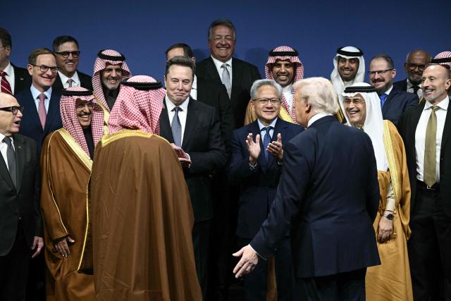 US President Donald Trump, Saudi Crown Prince, Prime Minister Mohammed bin Salman and other attendees, arrive for a family picture the US-Saudi Investment Forum at the John F. Kennedy Center for the Performing Arts in Washington, DC on November 19, 2025. (Photo by Brendan SMIALOWSKI / AFP)