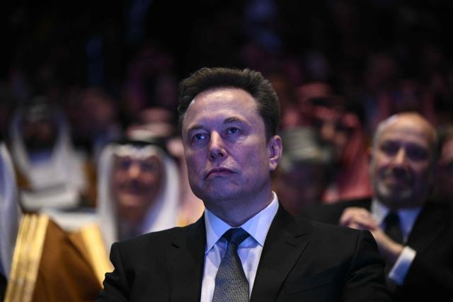 Elon Musk looks on as US President Donald Trump speaks at the US-Saudi Investment Forum at the John F. Kennedy Center for the Performing Arts in Washington, DC on November 19, 2025. (Photo by Brendan SMIALOWSKI / AFP)