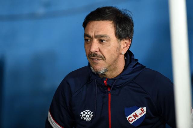 (FILES) Nacional's head coach Alvaro Recoba gestures during the Copa Libertadores group stage second leg football match between Uruguay's Nacional and Argentina's River Plate at the Gran Parque Central stadium in Montevideo on May 7, 2024. Uruguayan coach Alvaro "Chino" Recoba will take on his first international challenge as a manager at the helm of Deportivo Tachira, the most successful Venezuelan football club over the past five years, the team announced on November 19, 2025. (Photo by DANTE FERNANDEZ / AFP)