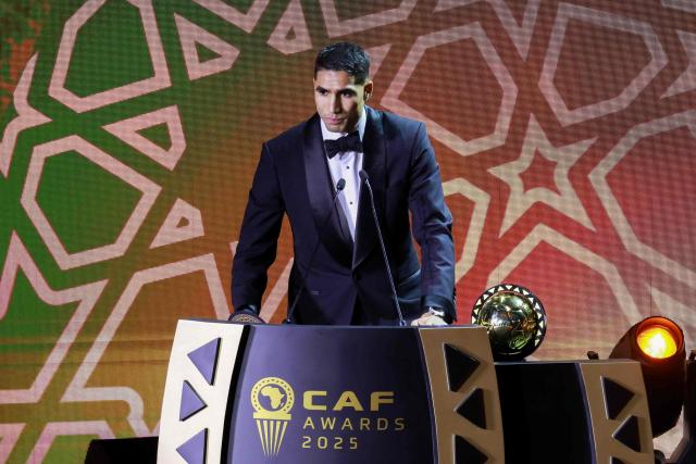 Paris Saint-Germain's Moroccan defender Achraf Hakimi speaks after receiving the Africa Player of the Year award during the 2025 Confederation of African Football (CAF) Awards in Sale, Morocco on November 19, 2025. (Photo by Abdel Majid BZIOUAT / AFP)