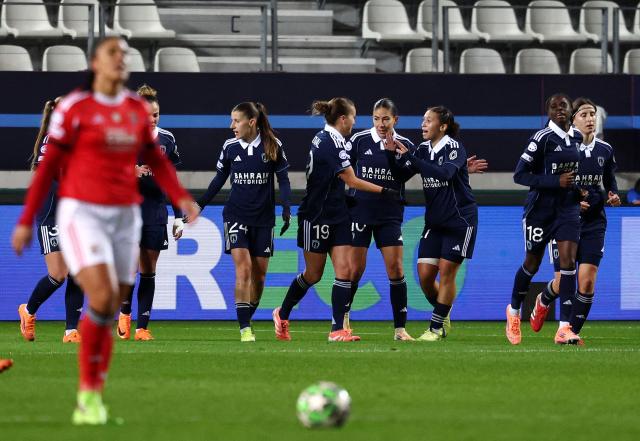 Paris FC's midfielder #27 Maeline Mendy (3rdR) is congratulated by teammates after scoring a goal  during the UEFA Women's Champions League first round day 4 football match between Paris FC and SL Benficia at the Stade Jean Bouin in Paris on November 19, 2025. (Photo by FRANCK FIFE / AFP)