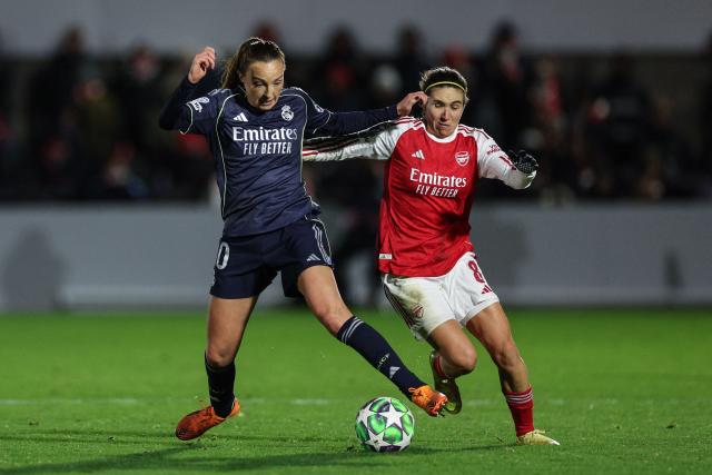 Arsenal's Spanish midfielder #08 Mariona Caldentey (R) clashes with Real Madrid's Scottish midfielder #10 Caroline Weir  during the women's UEFA Champions League league phase football match between Arsenal and Real Madrid at the Mangata Developments Stadium Meadow Park, in north London, on November 19, 2025. (Photo by Adrian Dennis / AFP)