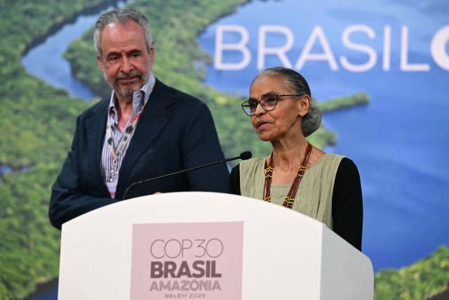Environment Minister Marina Silva (R) speaks alongside COP30 President Andre Correa do Lago during a press conference at the COP30 UN Climate Change Conference in Belem, Para state, Brazil, on November 19, 2025. Brazilian President Luiz Inacio Lula da Silva hit the corridors of COP30 in Belem on Wednesday, in a push to land a deal at the UN climate talks as nations remained divided over contentious issues. (Photo by Pablo PORCIUNCULA / AFP)