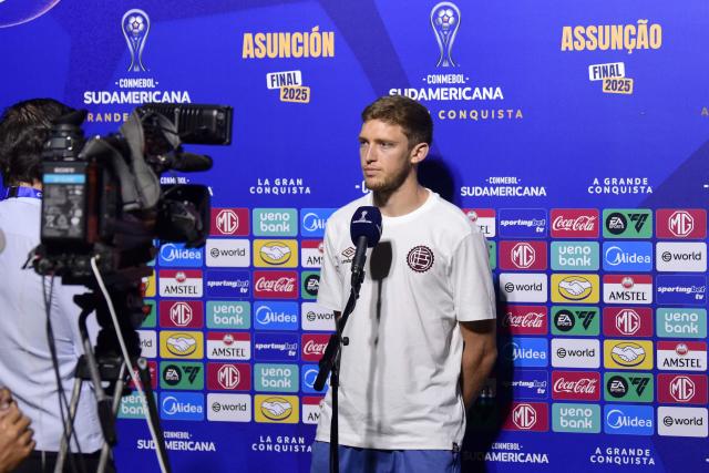 Lanus' midfielder Rodrigo Castillo looks on during a press conference upon arrival at the military base of the Silvio Pettirossi International Airport in Luque, Paraguay on November 19, 2025, ahead of the Copa Sudamericana final football match between Argentina's Lanus and Brazil's Atletico Mineiro in Asuncion on November 22. (Photo by DANIEL DUARTE / AFP)