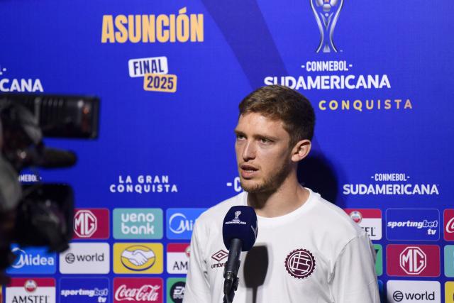 Lanus' midfielder Rodrigo Castillo speaks during a press conference upon arrival at the military base of the Silvio Pettirossi International Airport in Luque, Paraguay on November 19, 2025, ahead of the Copa Sudamericana final football match between Argentina's Lanus and Brazil's Atletico Mineiro in Asuncion on November 22. (Photo by DANIEL DUARTE / AFP)