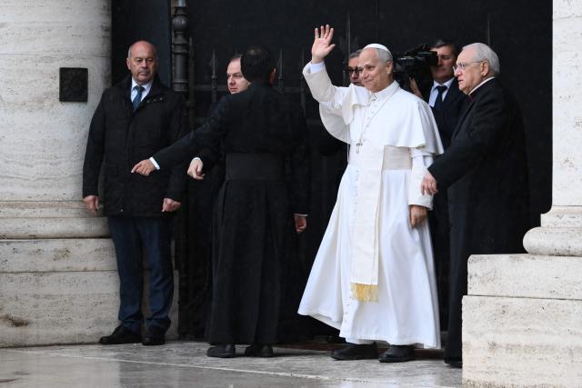 Pope Leo XIV waves as arrives at the Basilica di Santa Maria degli Angeli for the closing of the Italian Episcopal Conference (CEI) in Assisi on November 20, 2025. (Photo by Alberto PIZZOLI / AFP)