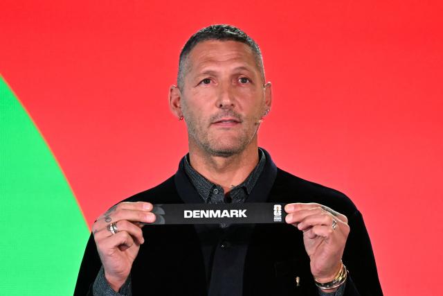 Italian former player Marco Materazzi shows the paper slip of Denmark during the 2026 FIFA World Cup European Play-Off draw at the FIFA's Home of Football in Zurich on November 20, 2025. (Photo by Fabrice COFFRINI / AFP)