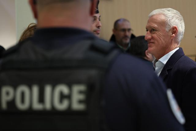 France's football team head coach Didier Deschamps arrives at the Criminal Court for the slander lawsuit against French Sports journalist Daniel Riolo in Paris on November 20, 2025. Riolo is facing trial on November 20, 2025 for slander after accusing France's national football team headcoach Didier Deschamps of "lying" about the severity of France's forward Karime Benzema's injury during the 2022 World Cup in Qatar. (Photo by Anne-Christine POUJOULAT / AFP)