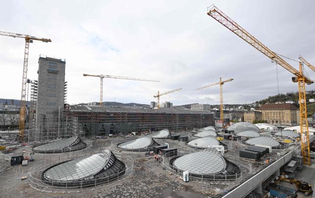 An overview picture shows skylights on the roof of the new underground main station of the railway development project Stuttgart 21 (S21) in Stuttgart, southern Germany, on November 20, 2025. The opening of a mammoth German rail project, which has become emblematic of the infrastructure woes plaguing Europe's biggest economy, has been delayed yet again, reports said November 19, 2025. "Stuttgart 21" is envisaged as a futuristic rail hub in the southwestern city, but its inauguration has been repeatedly pushed back from an original date of 2019. Trains were due to finally start running from the new underground station in December 2026, before a full opening in the summer of 2027. (Photo by THOMAS KIENZLE / AFP)