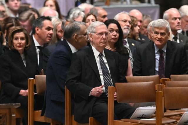 US Senator Mitch McConnell (C), Republican of Kentucky and other members of the congress arrive at the funeral service for late US Vice President Dick Cheney at the Washington National Cathedral in Washington, DC, on November 20, 2025. (Photo by SAUL LOEB / AFP)