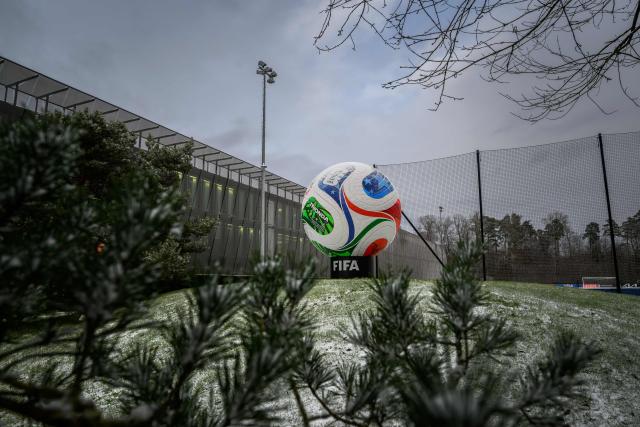This photograph shows a giant replica of 'Trionda', the official ball of the 2026 FIFA World Cup outside of the FIFA's Home of Football during the 2026 FIFA World Cup European Play-Off draw in Zurich on November 20, 2025. (Photo by Fabrice COFFRINI / AFP)