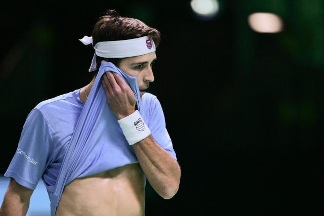 Argentina's Tomas Martin Etcheverry reacts during his Davis Cup men's singles quarter finals tennis match against Germany's Jan-Lennard Struff, at the Super Tennis Arena, in Bologna, northen Italy, on November 20, 2025. (Photo by Tiziana FABI / AFP)