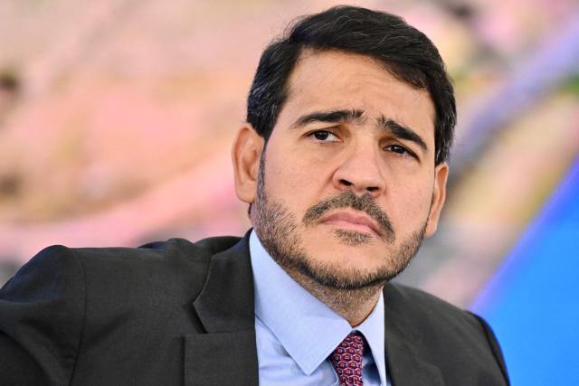 (FILES) Brazil’s Attorney General of the Union Jorge Messias looks on during the announcement of new measures to help the population affected by the Brumadinho dam collapse, in Brasilia on September 26, 2025. Brazilian President Luiz Inacio Lula da Silva nominated a trusted ally, lawyer Jorge Messias, to the Supreme Court on November 20, 2025, under scrutiny from the United States since the trial for coup plotting against former President Jair Bolsonaro. (Photo by Evaristo Sa / AFP)