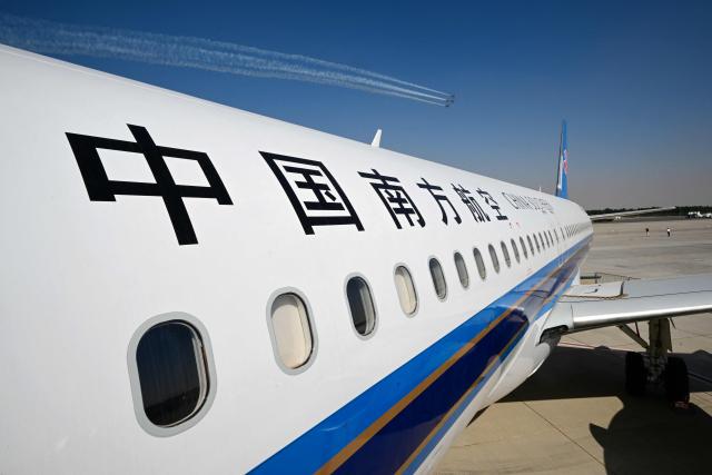 The Chinese Comac C919 is on display at Al-Maktoum International Airport during the Dubai Airshow 2025 in Dubai on November 20, 2025. (Photo by Giuseppe CACACE / AFP)