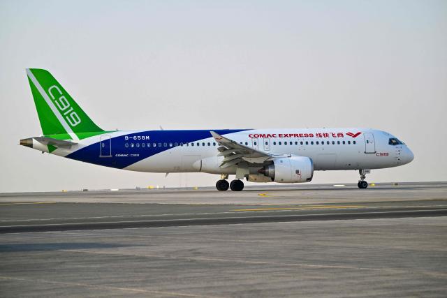 The Chinese Comac C919 prepares for take-off at Al-Maktoum International Airport during the Dubai Airshow 2025 in Dubai on November 20, 2025. (Photo by Giuseppe CACACE / AFP)