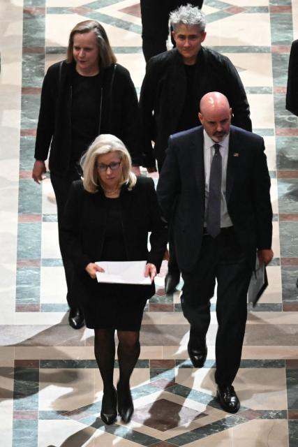 Former Representative Liz Cheney (L), Republican of Wyoming, walks out of the cathedral following the funeral service for her late father former US Vice President Dick Cheney at the Washington National Cathedral in Washington, DC, on November 20, 2025. Dick Cheney, celebrated as a master Republican strategist but defined by the darkest chapters of America's "War on Terror," was honored Thursday in a funeral attended by Washington's elite that pointedly left out President Donald Trump. (Photo by SAUL LOEB / AFP)