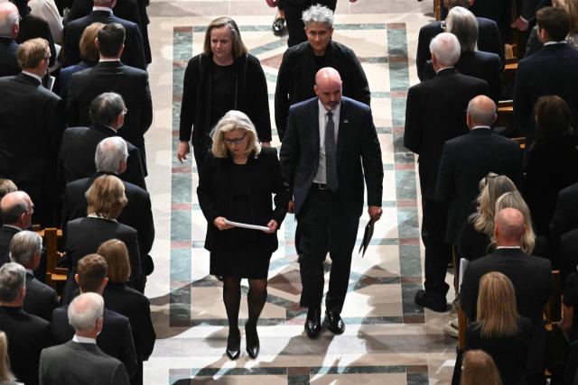 Former Representative Liz Cheney (L), Republican of Wyoming, walks out of the cathedral following the funeral service for her late father former US Vice President Dick Cheney at the Washington National Cathedral in Washington, DC, on November 20, 2025. Dick Cheney, celebrated as a master Republican strategist but defined by the darkest chapters of America's "War on Terror," was honored Thursday in a funeral attended by Washington's elite that pointedly left out President Donald Trump. (Photo by SAUL LOEB / AFP)