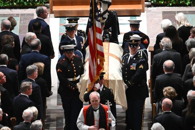 US military honor guards carry the casket of late US Vice President Dick Cheney during a funeral service at the Washington National Cathedral in Washington, DC, on November 20, 2025. Dick Cheney, celebrated as a master Republican strategist but defined by the darkest chapters of America's "War on Terror," was honored Thursday in a funeral attended by Washington's elite that pointedly left out President Donald Trump. (Photo by SAUL LOEB / AFP)