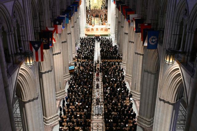 Clergy members walk ahead of the casket during late US Vice President Dick Cheney's funeral service at the Washington National Cathedral in Washington, DC, on November 20, 2025. Dick Cheney, celebrated as a master Republican strategist but defined by the darkest chapters of America's "War on Terror," was honored Thursday in a funeral attended by Washington's elite that pointedly left out President Donald Trump. (Photo by SAUL LOEB / AFP)