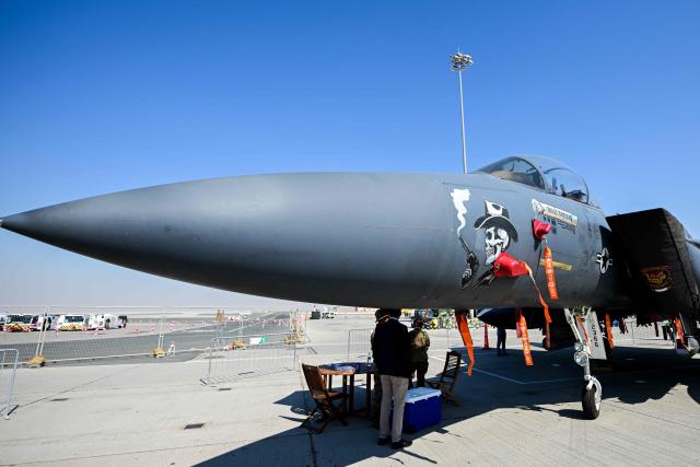 A McDonnell Douglas F-15E is displayed at Al-Maktoum International Airport during the Dubai Airshow 2025 in Dubai on November 20, 2025. (Photo by Giuseppe CACACE / AFP)