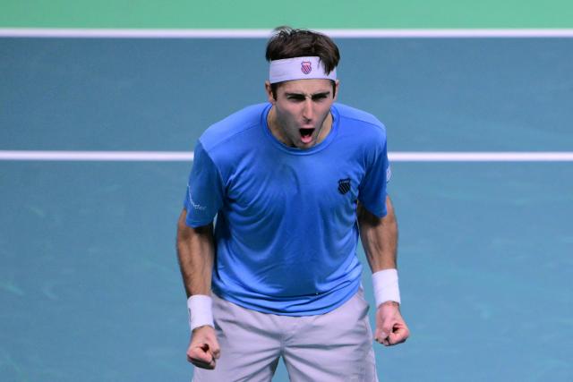 Argentina's Tomas Martin Etcheverry celebrates winning his Davis Cup men's singles quarter finals tennis match against Germany's Jan-Lennard Struff, at the Super Tennis Arena, in Bologna, northen Italy, on November 20, 2025. (Photo by Tiziana FABI / AFP)