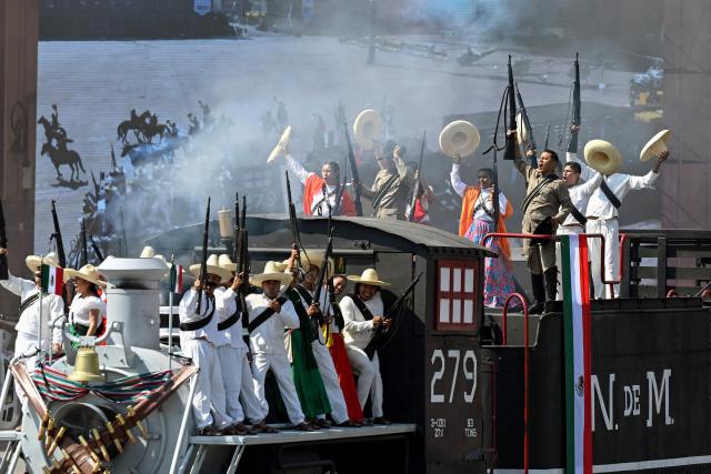 Actors take part in the parade for the 115th anniversary of the Mexican Revolution at Zocalo Square in Mexico City on November 20, 2025. (Photo by Alfredo ESTRELLA / AFP)