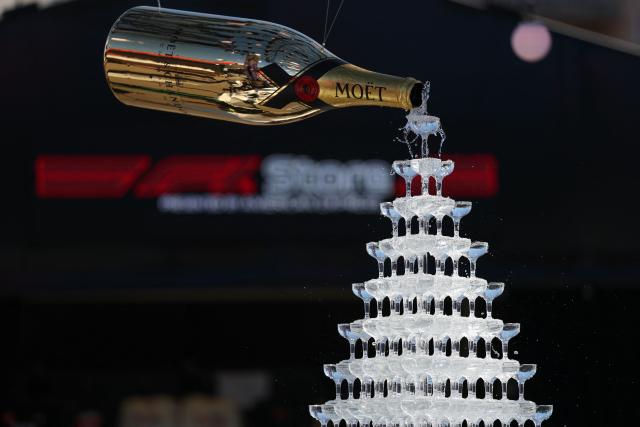A Moet & Chandon Champagne display is seen in the paddock ahead of the first practice session for the Las Vegas Formula One Grand Prix at the Las Vegas Strip Circuit in Las Vegas, Nevada, on November 20, 2025. (Photo by Patrick T. Fallon / AFP)