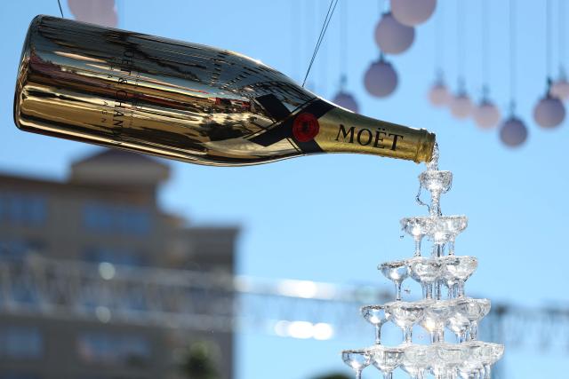 A Moet & Chandon Champagne display is seen in the paddock ahead of the first practice session for the Las Vegas Formula One Grand Prix at the Las Vegas Strip Circuit in Las Vegas, Nevada, on November 20, 2025. (Photo by Patrick T. Fallon / AFP)