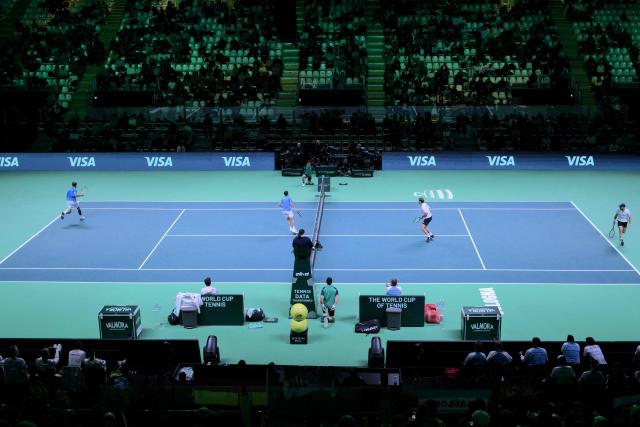 Argentina's Horacio Zeballos (2nd L) and Argentina's Andres Molteni (L) against Germany's Kevin Krawietz (2nd R) and Germany's Tim Puetz compete during their Davis Cup men's doubles quarter finals tennis match, at the Super Tennis Arena, in Bologna, northen Italy, on November 20, 2025. (Photo by Tiziana FABI / AFP)