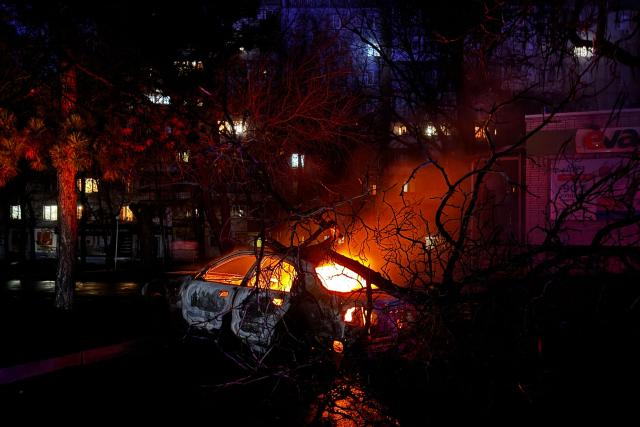 TOPSHOT - This photograph shows a car burning at the site of an air attack in Zaporizhzhia, on November 20, 2025, amid the Russian invasion of Ukraine. (Photo by Darya NAZAROVA / AFP)