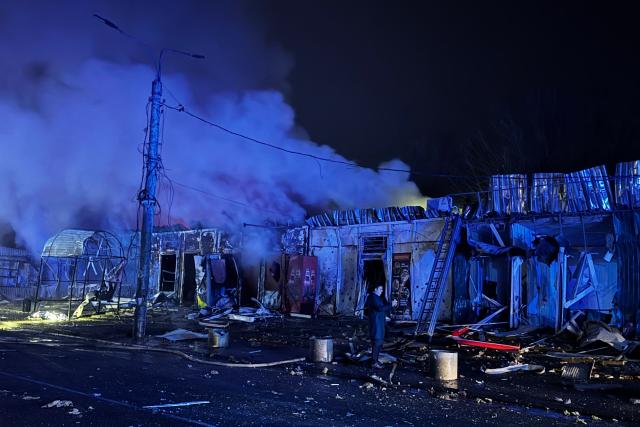 A man stands next to the site of an air attack in Zaporizhzhia, on November 20, 2025, amid the Russian invasion of Ukraine. (Photo by Darya NAZAROVA / AFP)