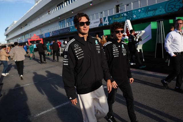 (L/R) Mercedes' British driver George Russell and Mercedes' Italian driver Kimi Antonelli walk in the paddock ahead of the first practice session for the Las Vegas Formula One Grand Prix at the Las Vegas Strip Circuit in Las Vegas, Nevada, on November 20, 2025. (Photo by Patrick T. Fallon / AFP)