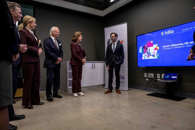 King Carl XVI Gustaf (C) and Queen Silvia (2R) of Sweden and Deputy Prime Minister of Sweden Ebba Busch (2L) visit the Mila Quebec AI Institute in Montreal, Canada, on November 20, 2025. The Swedish royal family arrived in Canada on November 18 to begin a three-day state visit. (Photo by ANDREJ IVANOV / AFP)