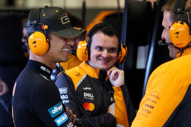 McLaren's British driver Lando Norris speaks with teammates in the garage during the first practice session for the Las Vegas Formula One Grand Prix at the Las Vegas Strip Circuit in Las Vegas, Nevada, on November 20, 2025. (Photo by Patrick T. Fallon / AFP)