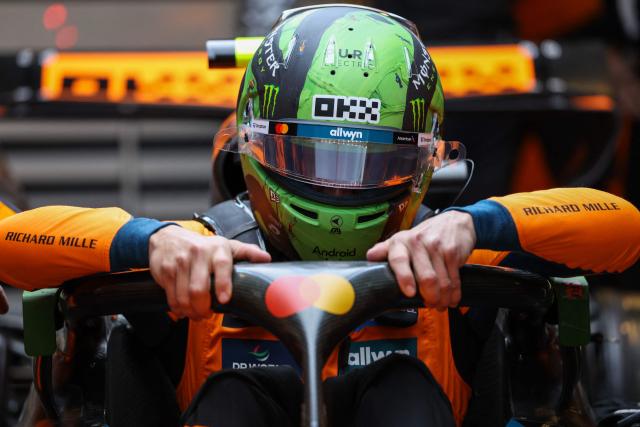 McLaren's British driver Lando Norris gets into his car during the first practice session for the Las Vegas Formula One Grand Prix at the Las Vegas Strip Circuit in Las Vegas, Nevada, on November 20, 2025. (Photo by Patrick T. Fallon / AFP)