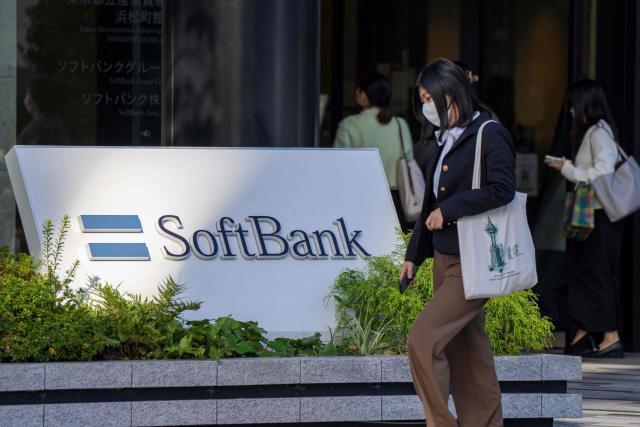 The logo of Japanese company SoftBank Group at the company's headquarters in Tokyo on November 21, 2025. Shares in Japanese tech investor SoftBank Group plunged as much as 10.7 percent on November 21, 2025, with chip-related stocks also down in Tokyo on renewed AI bubble fears. (Photo by Kazuhiro NOGI / AFP)