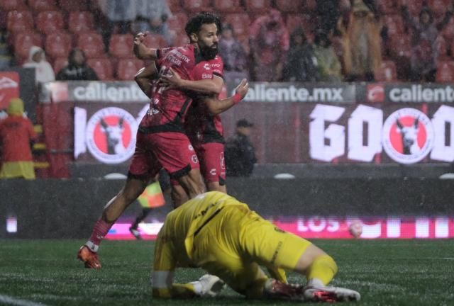 Tijuana's Spanish forward #21 Mourad El Ghezouani celebrates after scoring the equalising goal during the play-in of Liga MX Apertura football match between Tijuana and Juarez at Caliente Stadium in Tijuana, Mexico on November 20, 2025. (Photo by Guillermo Arias / AFP)