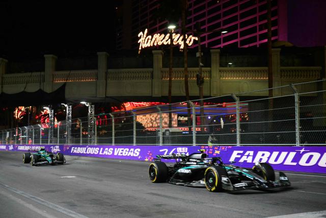 Mercedes' Italian driver Kimi Antonelli (R) and Aston Martin's Spanish driver Fernando Alonso race during the second practice session for the Las Vegas Formula One Grand Prix at the Las Vegas Strip Circuit in Las Vegas, Nevada, on November 20, 2025. (Photo by Frederic J. Brown / AFP)