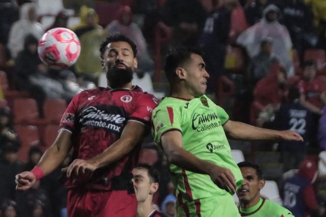 Tijuana's Spanish forward #21 Mourad El Ghezouani (L) and Juarez's defender #26 Jose Garcia fight for the ball during the play-in of Liga MX Apertura football match between Tijuana and Juarez at Caliente Stadium in Tijuana, Mexico on November 20, 2025. (Photo by Guillermo Arias / AFP)