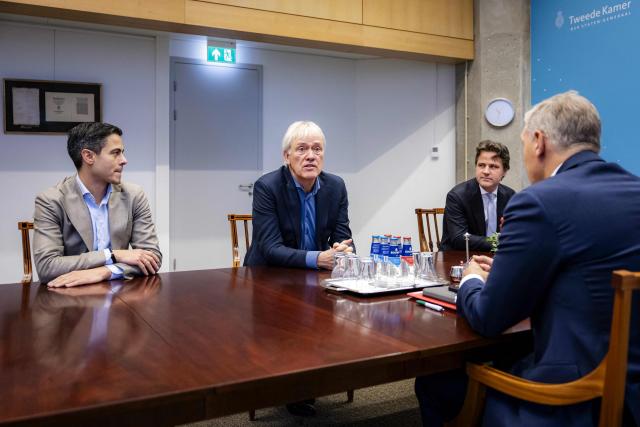 (From L) Dutch election winner and D66 party leader Rob Jetten, advisor on strengthening the investment climate and earning capacity Peter Wennink and leader of the Christian Democratic Appeal (CDA) Henri Bontenbal speak with informer and member of CDA party Sybrand van Haersma Buma during a coalition government meeting, in The Hague on November 21, 2025. (Photo by Sem van der Wal / ANP / AFP) / Netherlands OUT