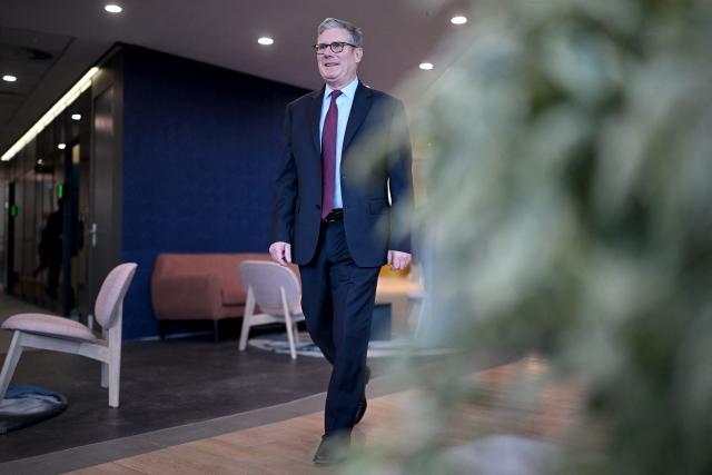 Britain's Prime Minister Keir Starmer arrives to speak to business leaders at EY headquarters in Johannesburg, on November 21, 2025 ahead of the G20 leaders' Summit. (Photo by Leon Neal / POOL / AFP)