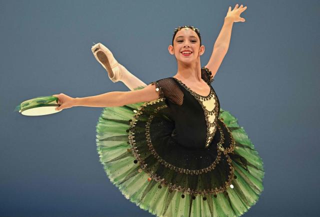 Gold medalist of the 'Junior' category  Victoria Carrillo from Master Ballet Academy of USA presents her programme on the stage of the National Dance Theatre in Budapest on November 20, 2025, during the final of the 3rd Budapest Ballet Grand Prix. (Photo by Attila KISBENEDEK / AFP)